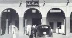 A car pulls up in front of the public security building in safat market place. The photograph was taken in 1939