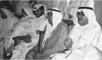 Kuwaiti men in traditional robes attend a meeting in Kuwait